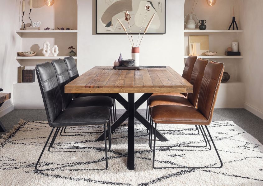 reclaimed wood dining table with brown and grey faux leather dining chairs