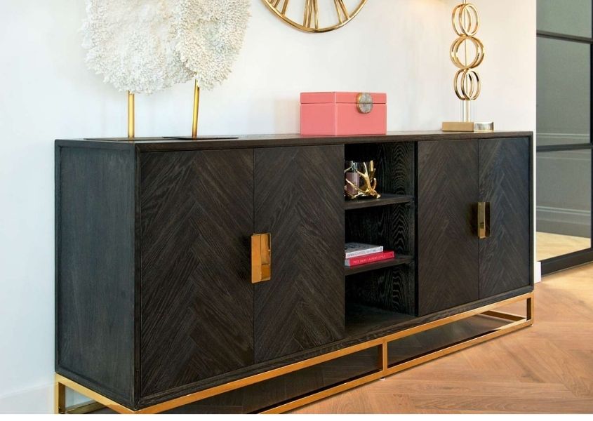 Dark wood sideboard with gold handle and frame