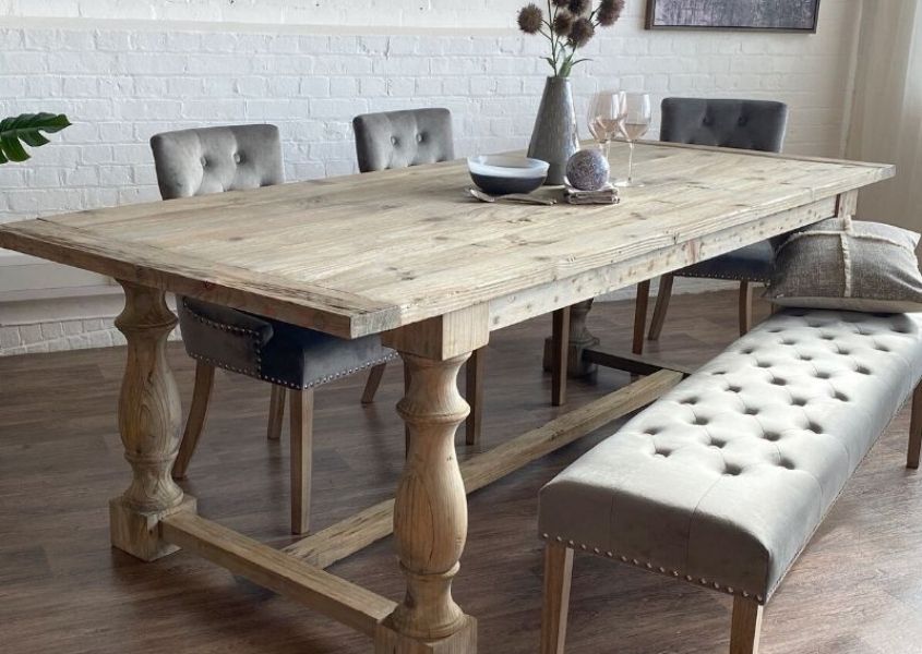 reclaimed wood dining table with grey fabric dining bench