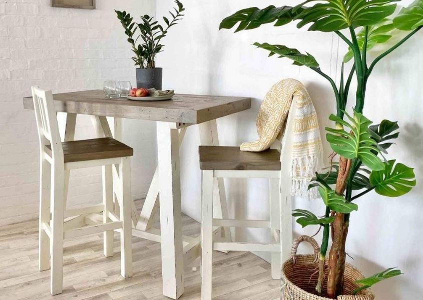 reclaimed wood breakfast table with white wooden bar stools