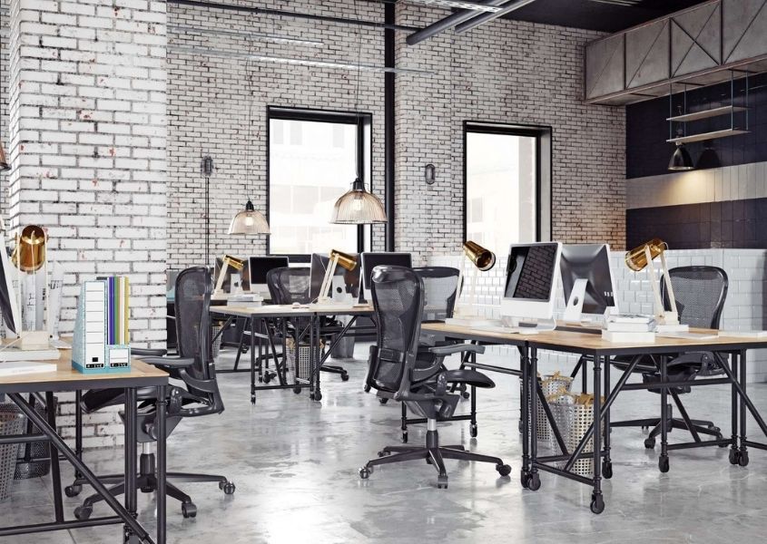Industrial work space with industrial metal desks and high back office chairs