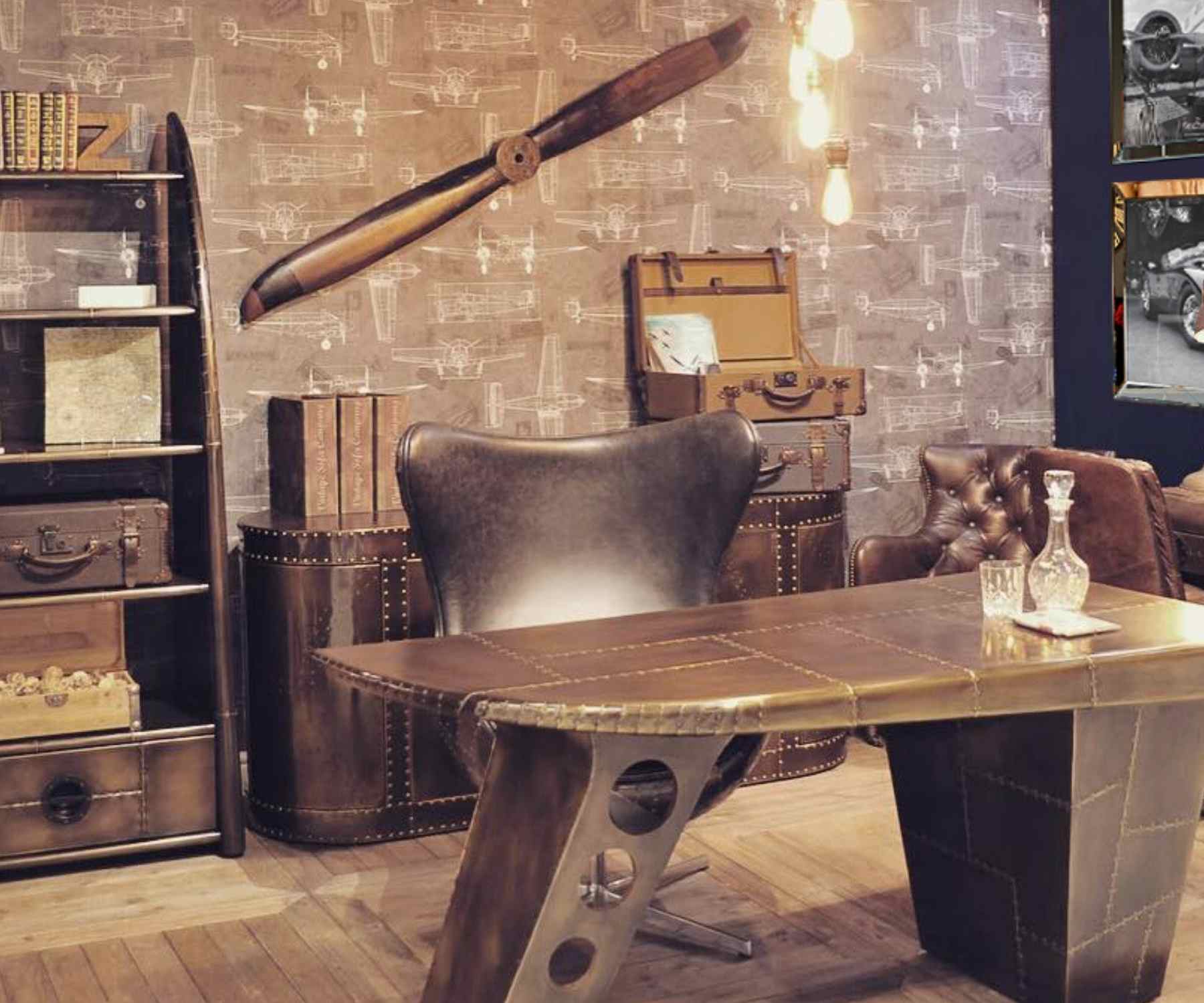 Aviator style desk with matching chair in office with exposed brick walls