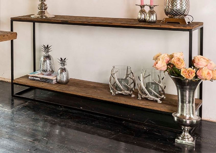 Industrial console table with silver flower vase