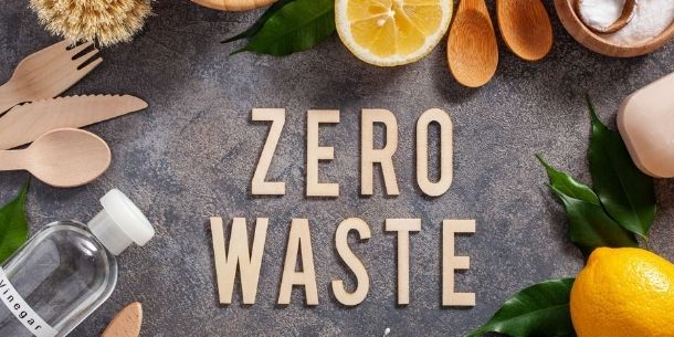 Words Zero Waste on concrete background with natural cleaning products