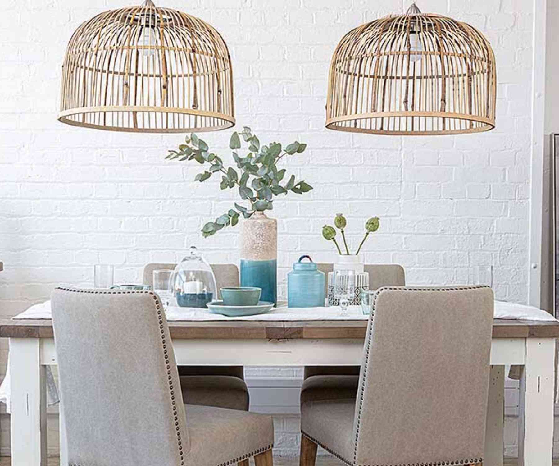 White bamboo double pendant light over white wood dining table