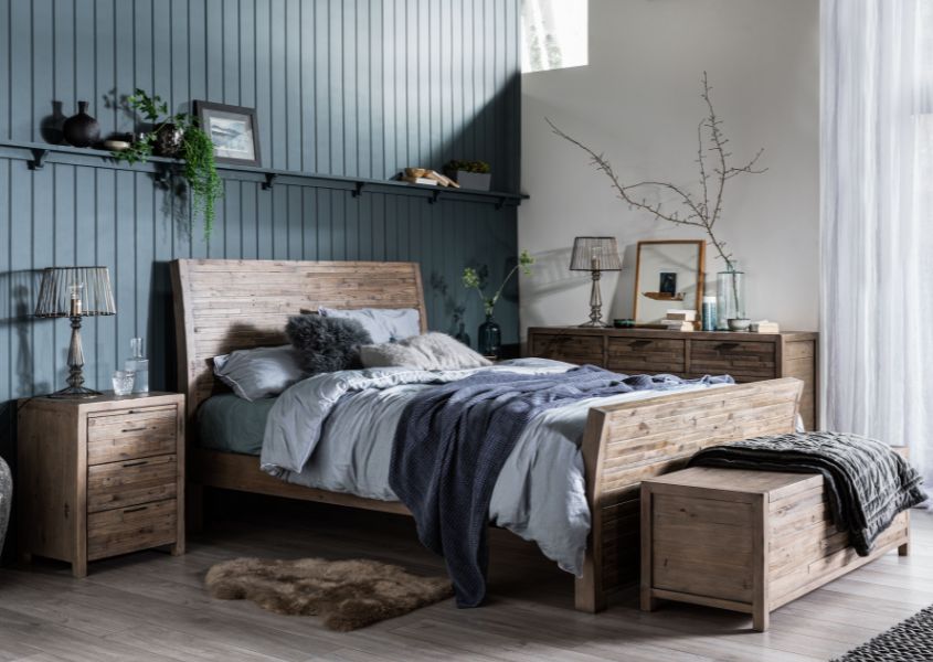 reclaimed solid wood bed with wooden blanket box and rustic bedside table