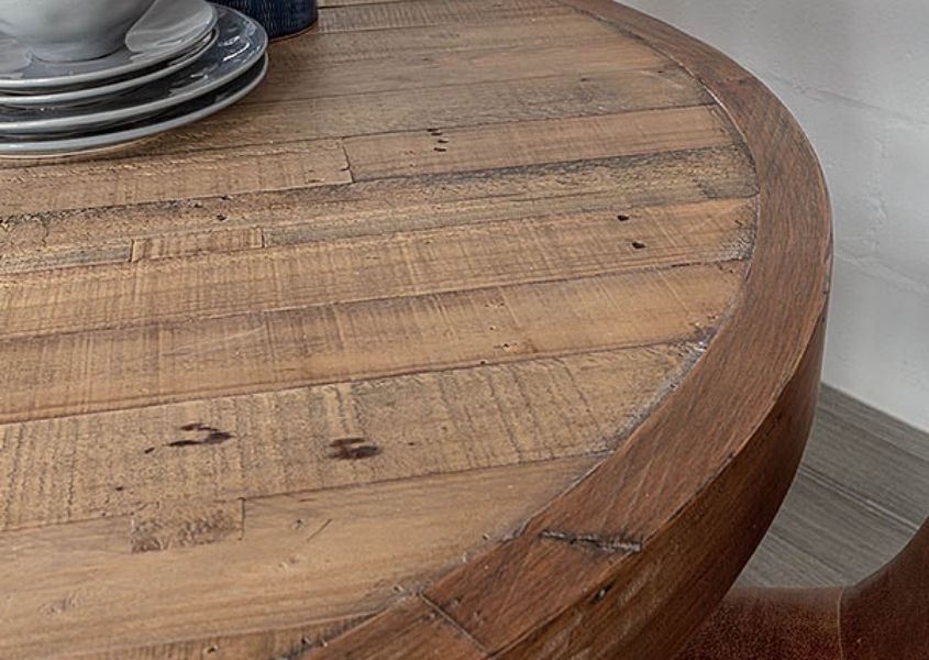 Close up of reclaimed wood round dining table