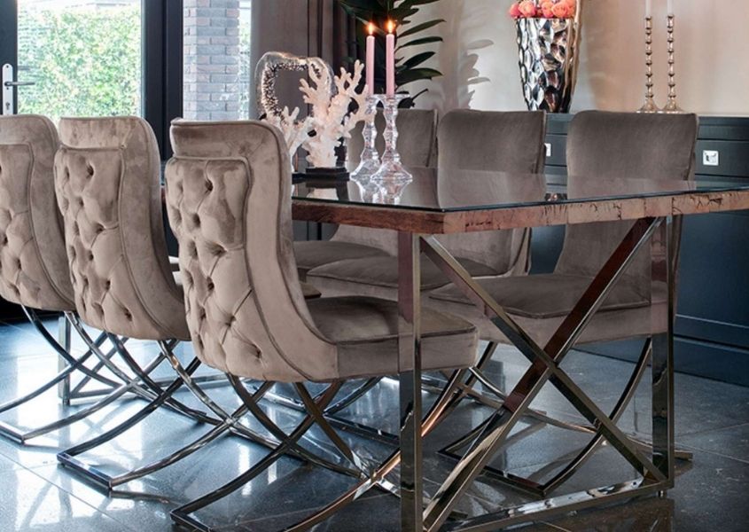 Reclaimed wood industrial dining table with stainless steel legs and grey velvet dining chairs
