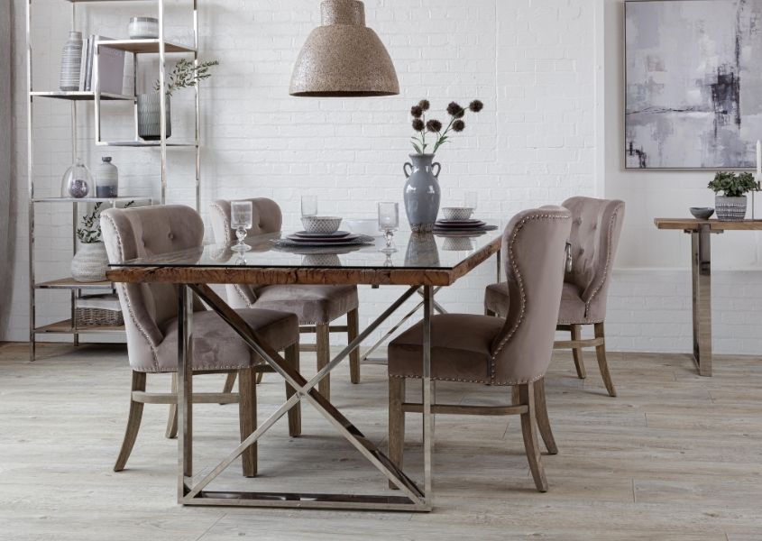 Industrial dining table with reclaimed wood top and grey fabric dining chairs