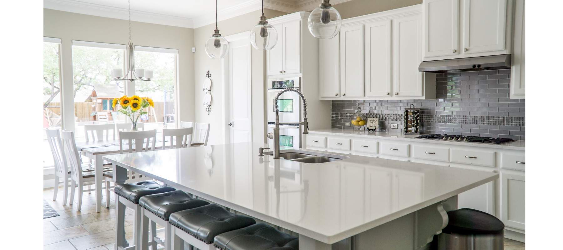 White kitchen with marble kitchen island
