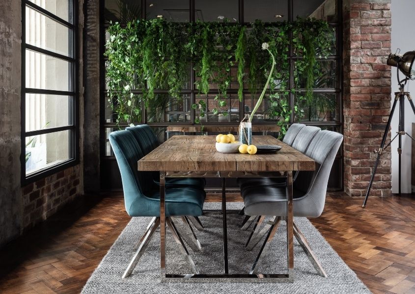 reclaimed wood dining table with grey and blue velvet dining chairs