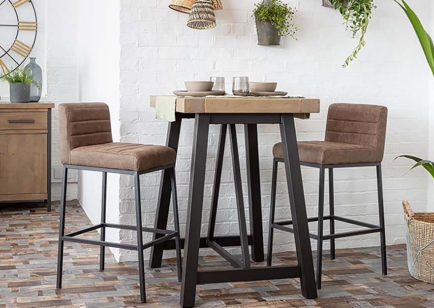 Brown faux leather bar stools with industrial bar table