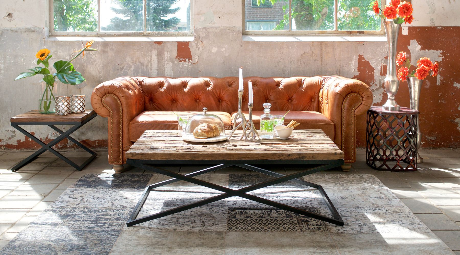 industrial coffee table with brown leather sofa
