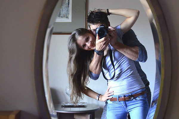 couple in front of mirror