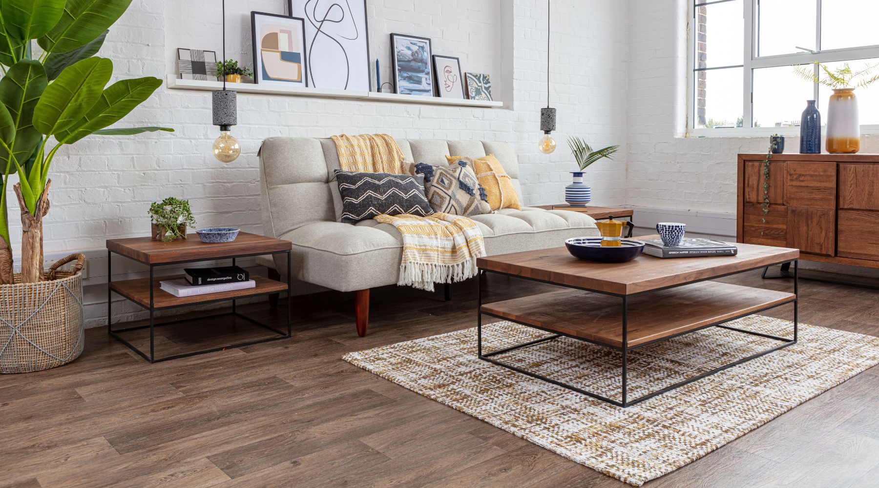 industrial coffee table with white sofa and yellow rug