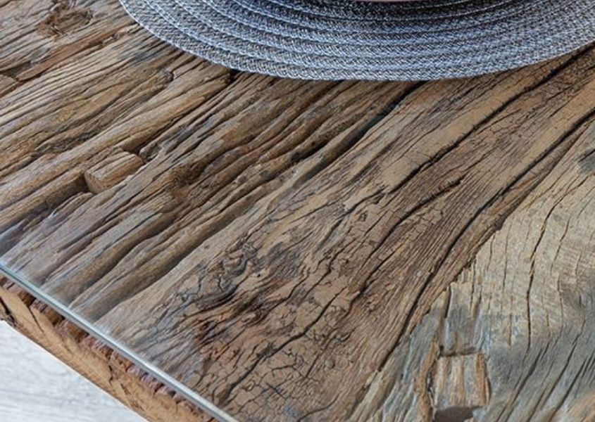 reclaimed wood dining table close up with glass top
