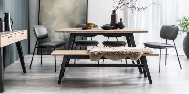 reclaimed wood dining table with black painted legs and matching wooden bench
