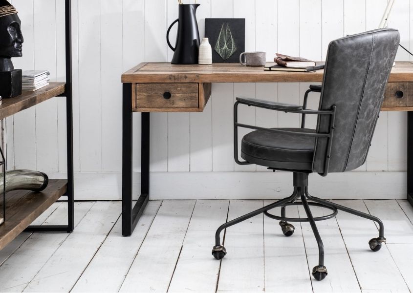 grey faux leather office chair next to industrial style desk