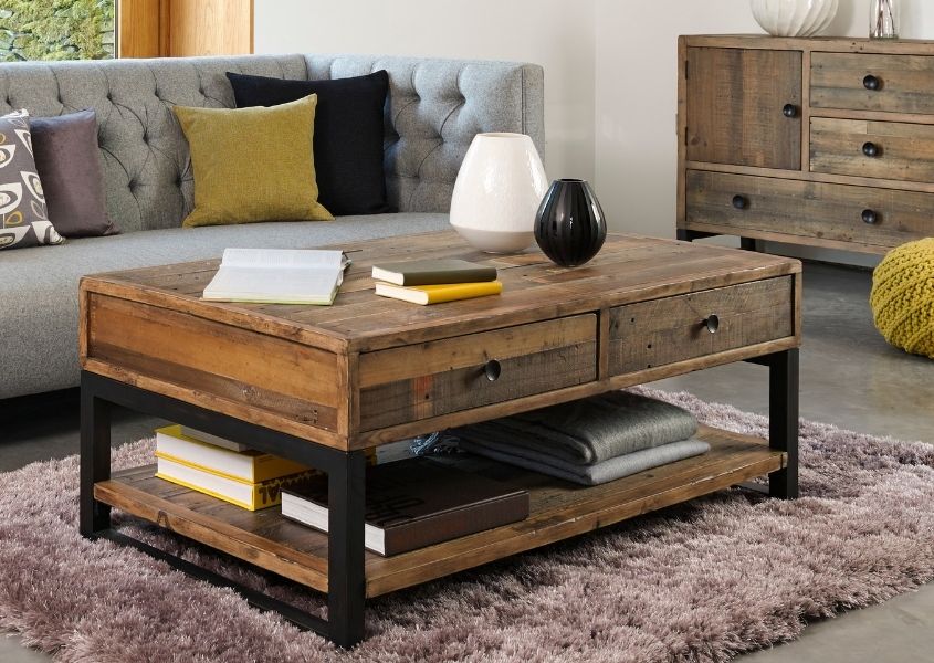 Industrial coffee table with two drawers on silver rug