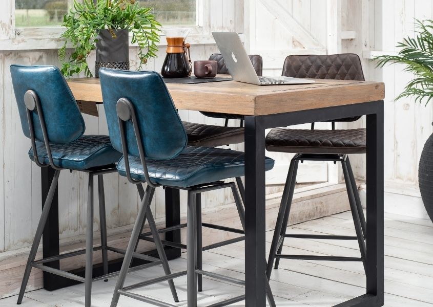 Industrial bar table in reclaimed wood with blue faux leather bar stools