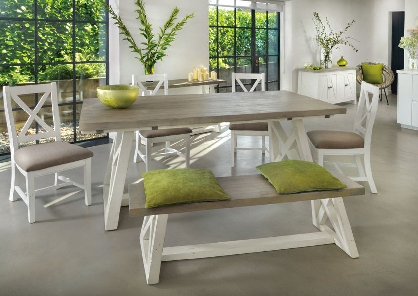 white painted reclaimed wood dining table with matching wooden dining bench
