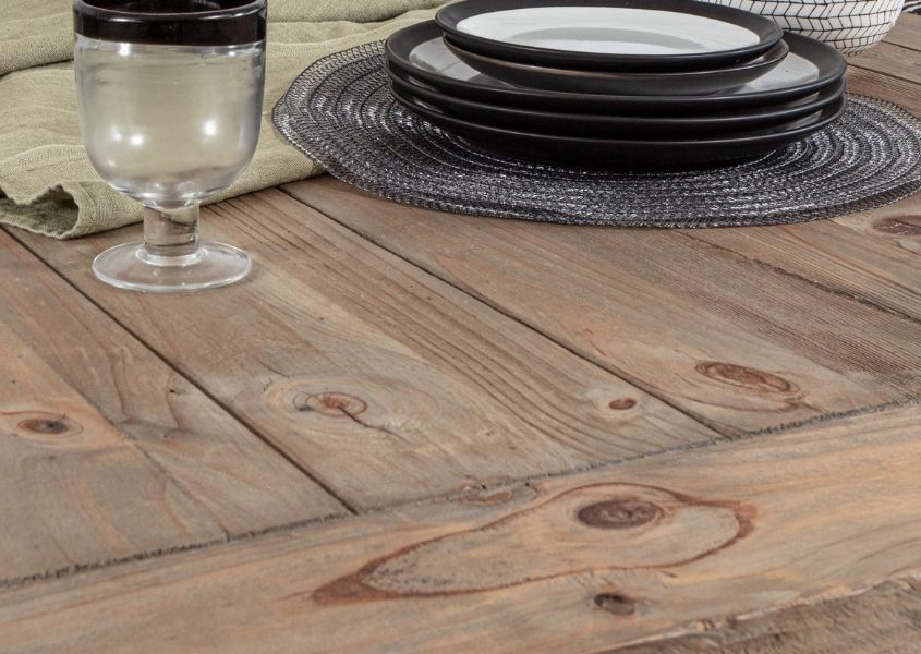 Close up of rustic wood with wine glass and plate