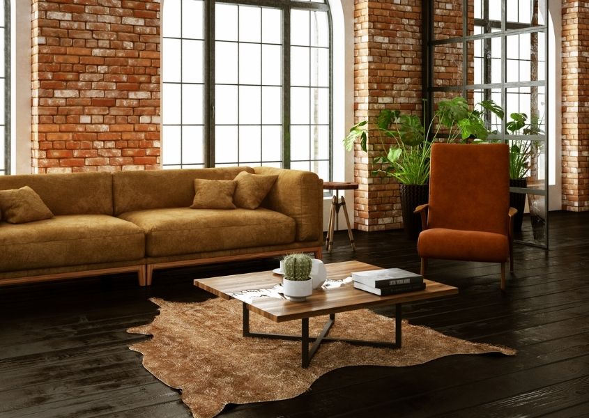 large sofa and wooden coffee table in loft style living room