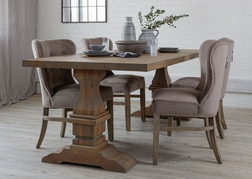 Reclaimed wood dining table with monastery legs and fabric dining chairs