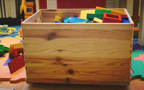 Wooden toy box in child bedroom